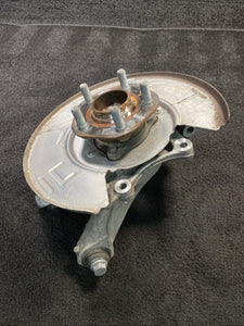1044411-00-F 17-23 Tesla Model 3 Rear Left Knuckle Spindle Hub & Dust Shield OEM 1044411-00-F